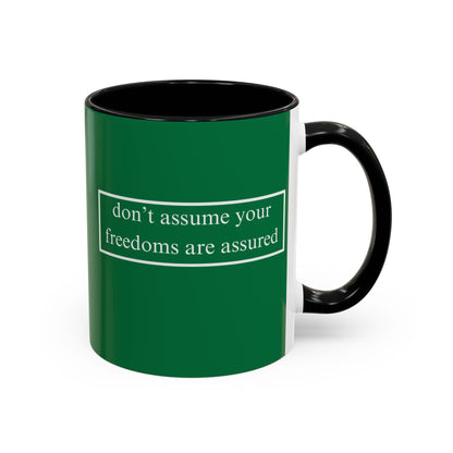 don't assume your freedoms are assured White font Green Accent Mug by theGreenDragonTavern.shop