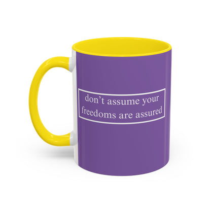 don't assume your freedoms are assured White font Light Purple Accent Mug by theGreenDragonTavern.shop