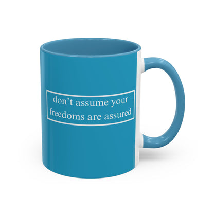 don't assume your freedoms are assured White font Turquoise Accent Mug by theGreenDragonTavern.shop