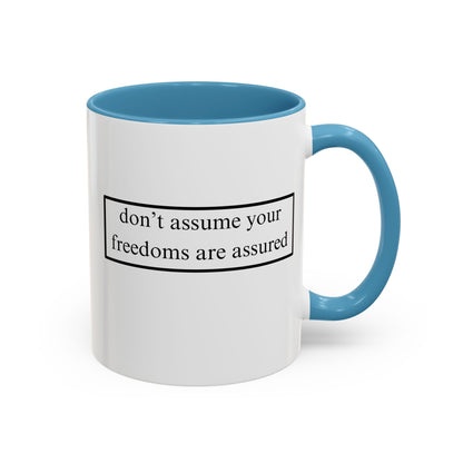 don't assume your freedoms are assured Black font White Accent Mug by theGreenDragonTavern.shop
