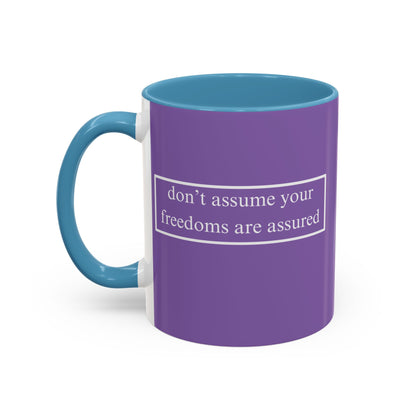 don't assume your freedoms are assured White font Light Purple Accent Mug by theGreenDragonTavern.shop