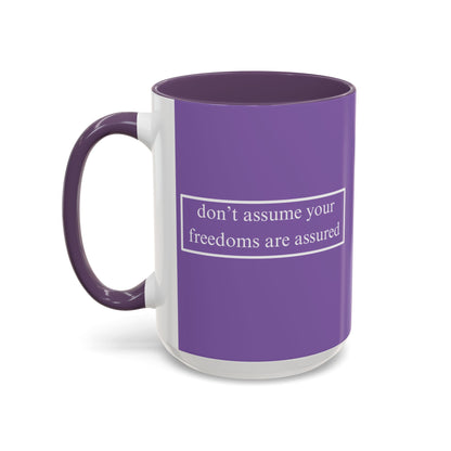 don't assume your freedoms are assured White font Light Purple Accent Mug by theGreenDragonTavern.shop