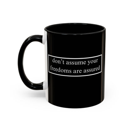 don't assume your freedoms are assured White font Black Accent Mug by theGreenDragonTavern.shop