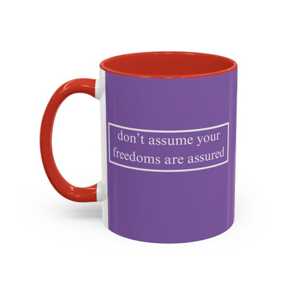 don't assume your freedoms are assured White font Light Purple Accent Mug by theGreenDragonTavern.shop