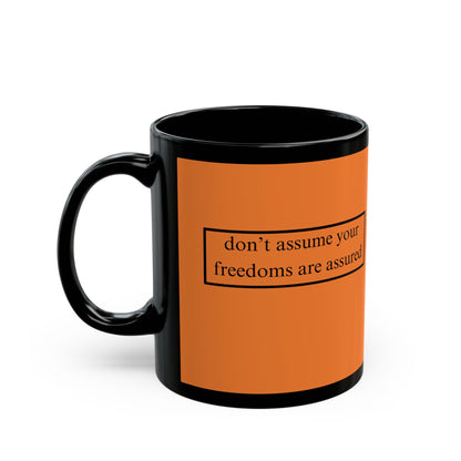 don't assume your freedoms are assured Black font Orange Mug by theGreenDragonTavern.shop