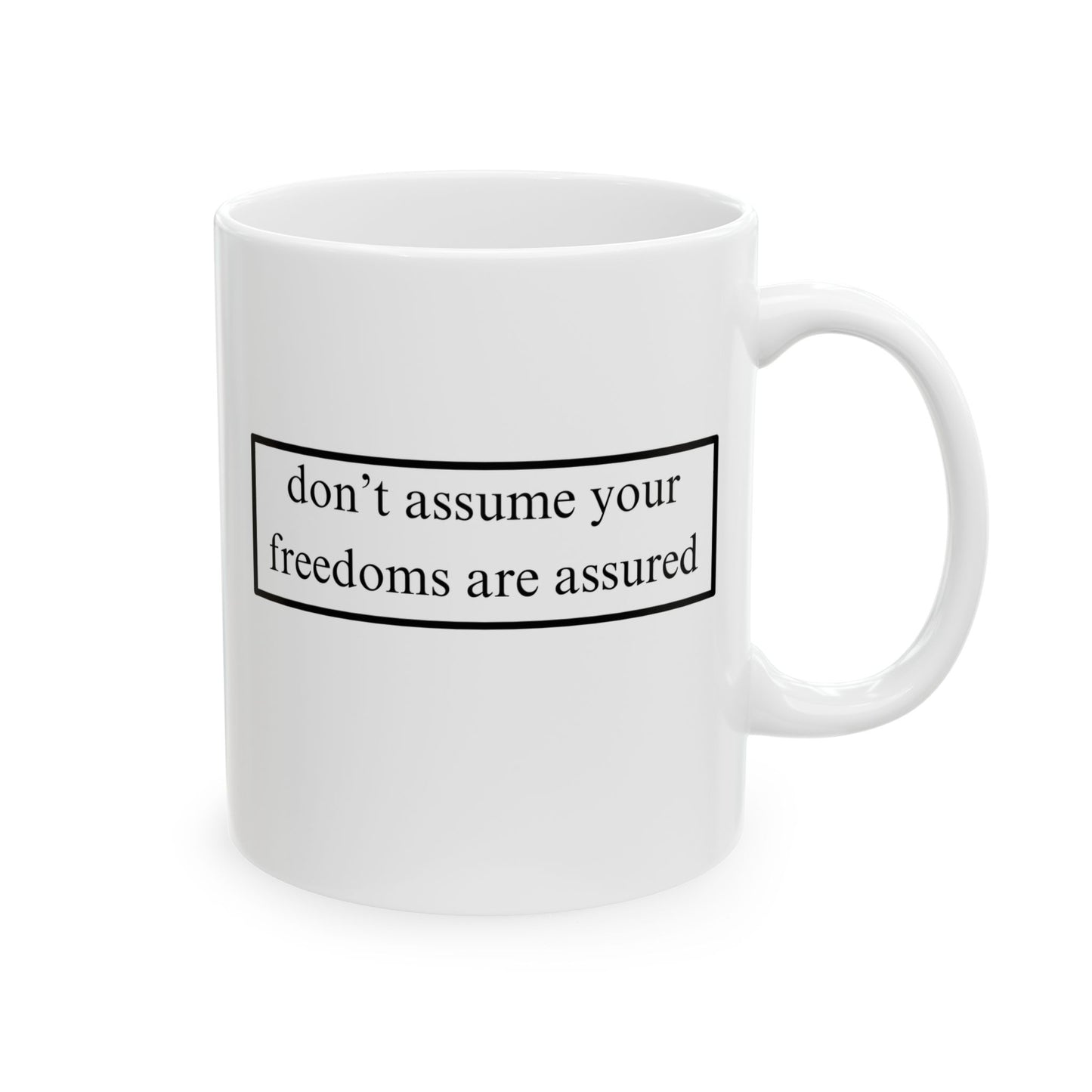 don't assume your freedoms are assured Black font White Mug by theGreenDragonTavern.shop
