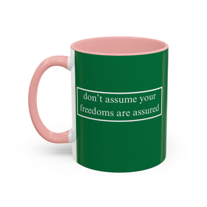 don't assume your freedoms are assured White font Green Accent Mug by theGreenDragonTavern.shop