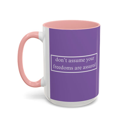 don't assume your freedoms are assured White font Light Purple Accent Mug by theGreenDragonTavern.shop