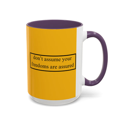 don't assume your freedoms are assured Black font Yellow Accent Mug by theGreenDragonTavern.shop