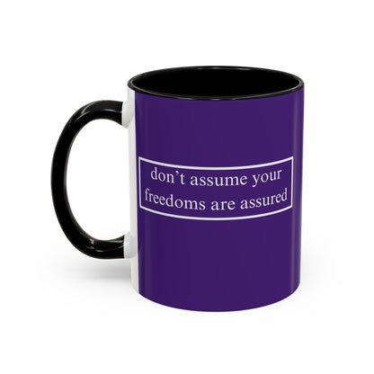 don't assume your freedoms are assured White font Dark Purple Accent Mug by theGreenDragonTavern.shop