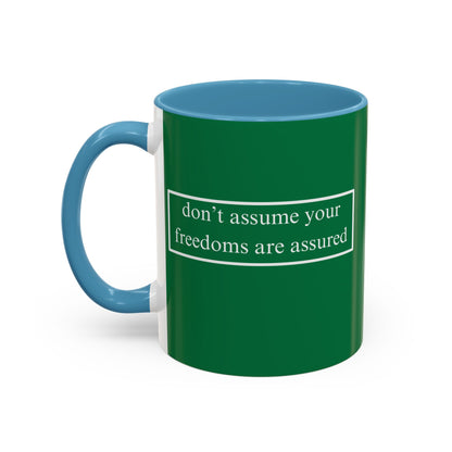 don't assume your freedoms are assured White font Green Accent Mug by theGreenDragonTavern.shop