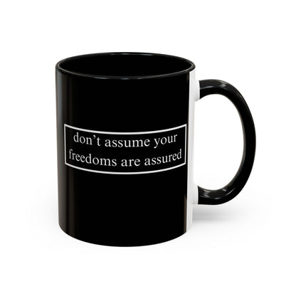don't assume your freedoms are assured White font Black Accent Mug by theGreenDragonTavern.shop